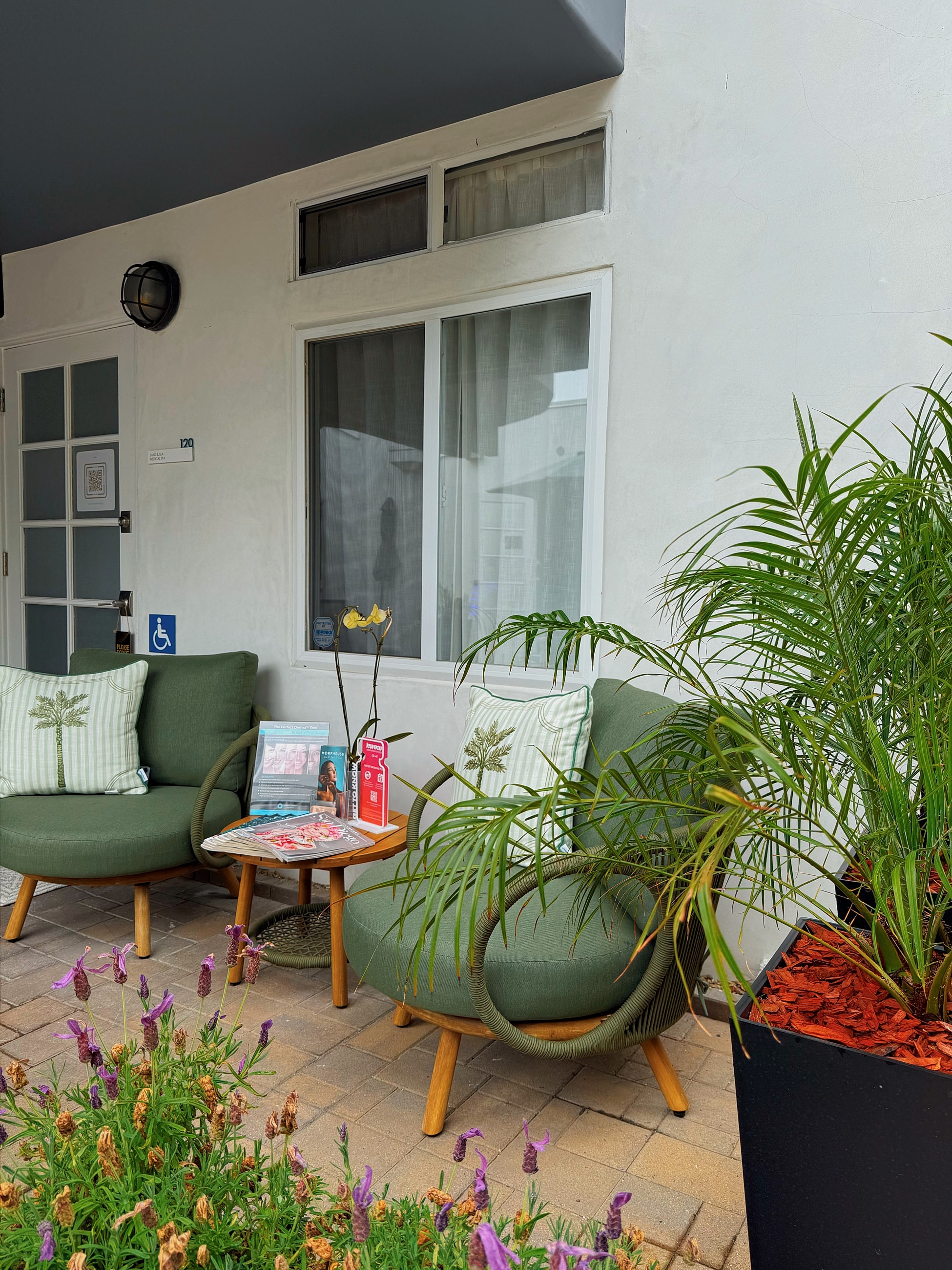 Woman holding "Coming Soon" spa announcement.