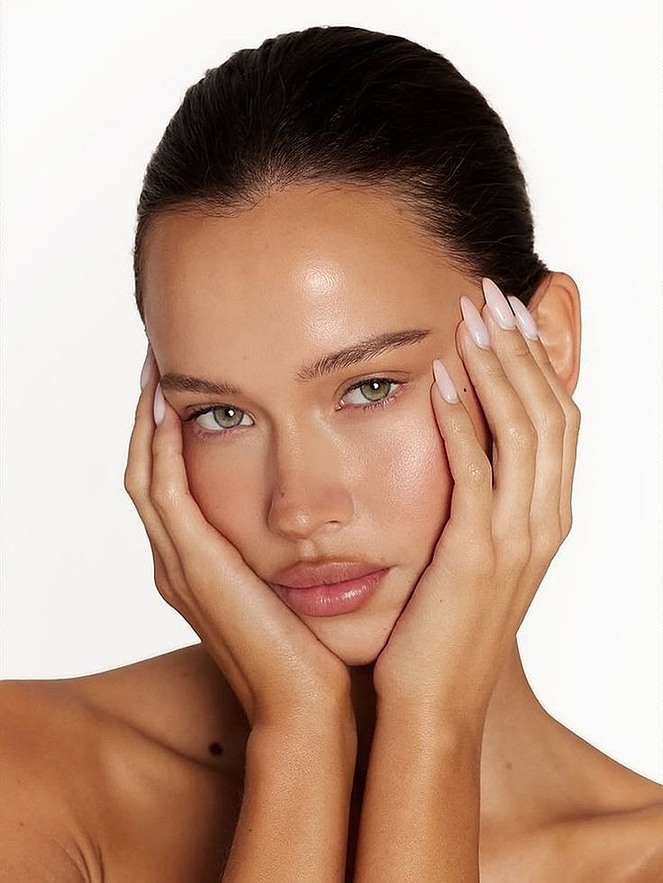 Close-up of a woman with long dark hair.