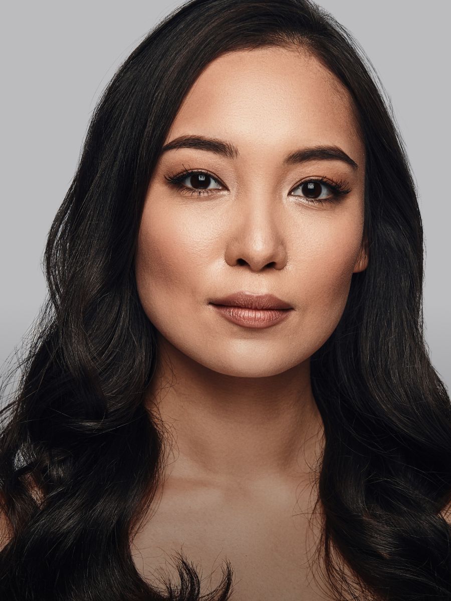 Portrait of a woman with long black hair.