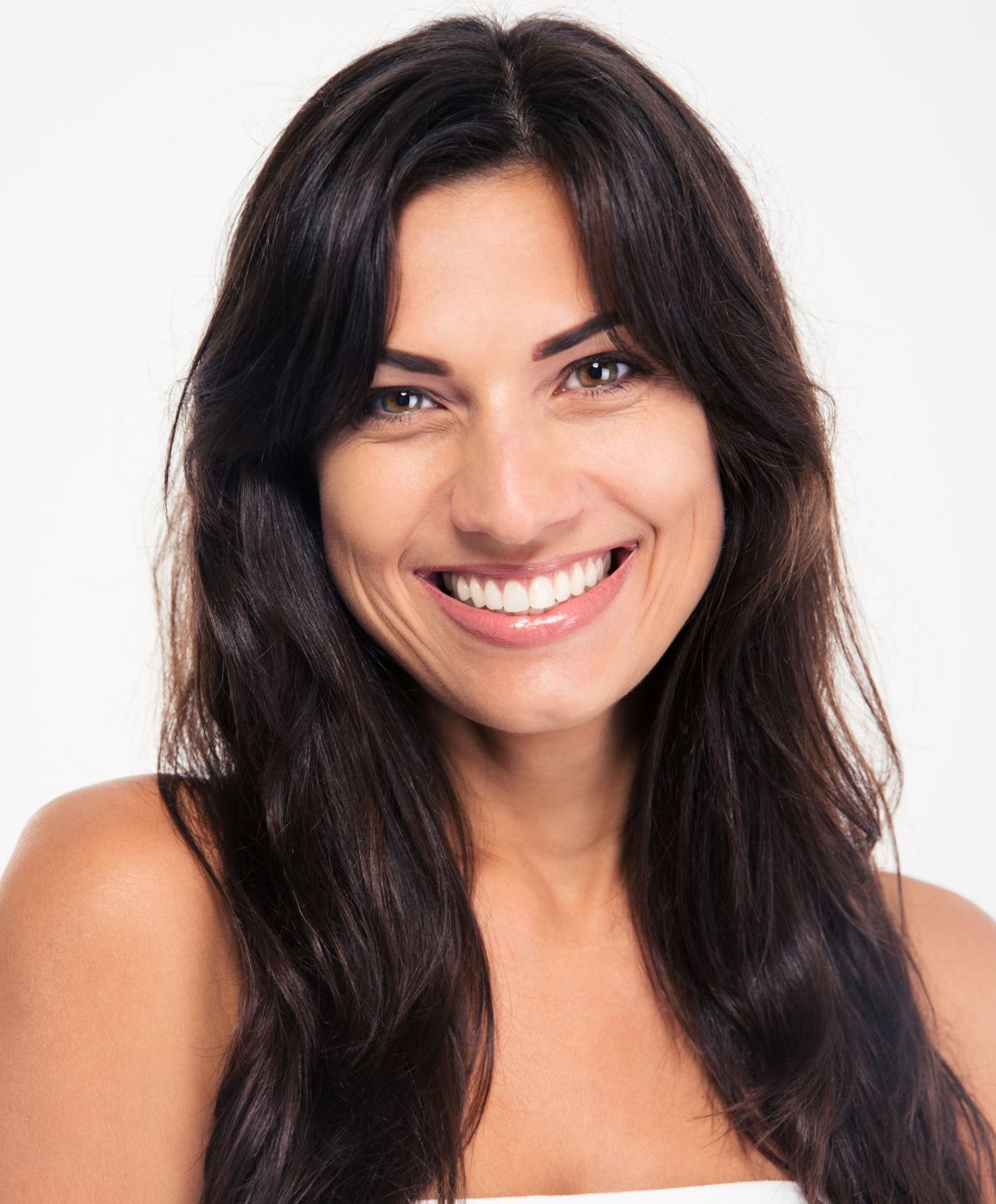 Smiling woman with long dark hair.