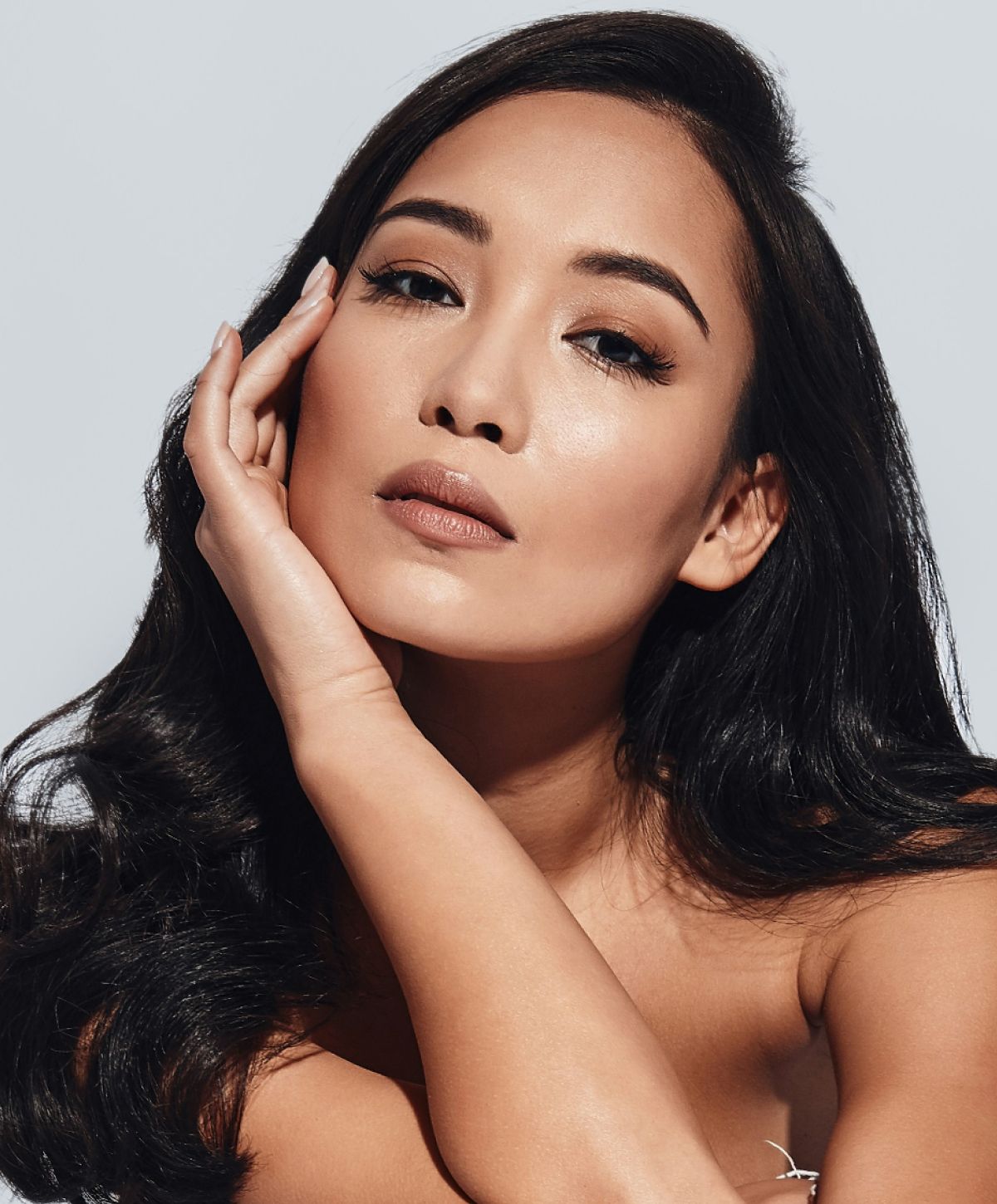 Model with elegant pose and natural makeup.