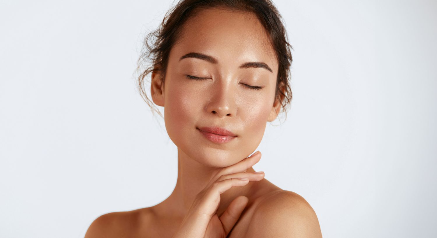 Woman with closed eyes and serene expression.